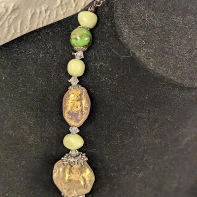 Beautiful beaded necklace with greens and golds irregularly shaped beads