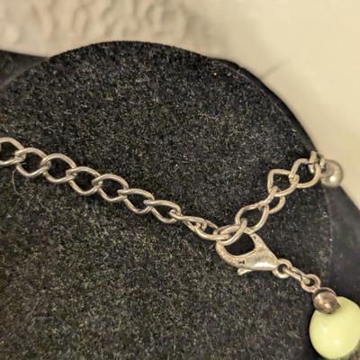 Beautiful beaded necklace with greens and golds irregularly shaped beads