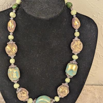 Beautiful beaded necklace with greens and golds irregularly shaped beads