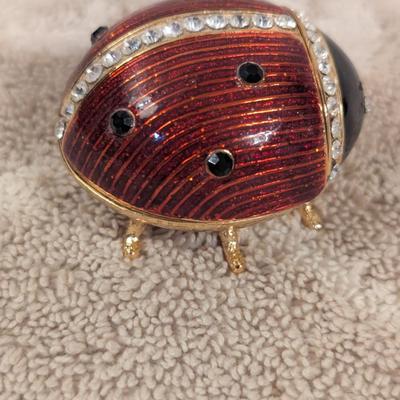 enameled pewter ladybug trinket box with rhinestone accents and storage box for it.