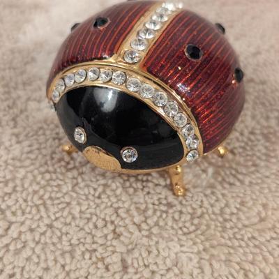 enameled pewter ladybug trinket box with rhinestone accents and storage box for it.