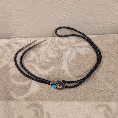 silvertone bear paw bolo with turquoise colored stone