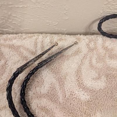 silvertone bear paw bolo with turquoise colored stone