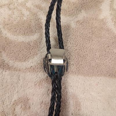 silvertone bear paw bolo with turquoise colored stone