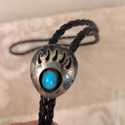 silvertone bear paw bolo with turquoise colored stone