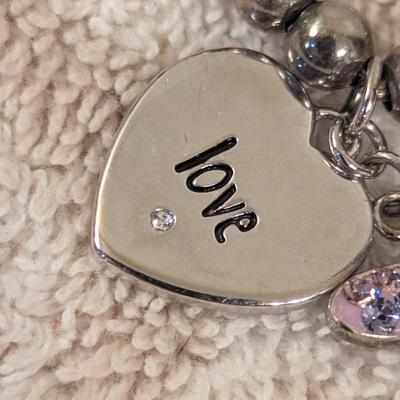 "Truly Inspired" silver-plated adjustable bracelet with a butterfly charm made with Swarovski® crystals.