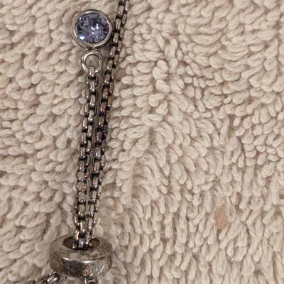 "Truly Inspired" silver-plated adjustable bracelet with a butterfly charm made with Swarovski® crystals.