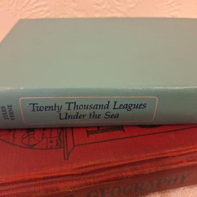 Huckleberry Finn, Twenty Thousand Leagues Under the Sea and Human Use Geography books.