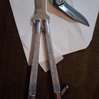 2 knives, Gerber mini folding knife and a butterfly knife