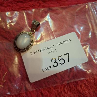 vintage sterling silver oval pendant with mother of pearl or white stone
