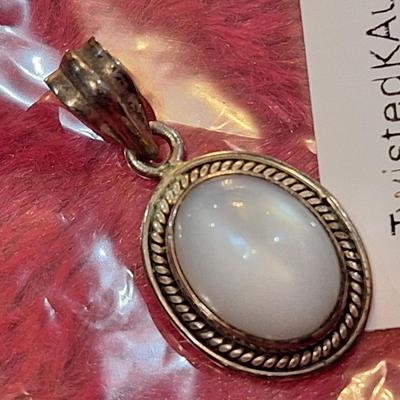 vintage sterling silver oval pendant with mother of pearl or white stone