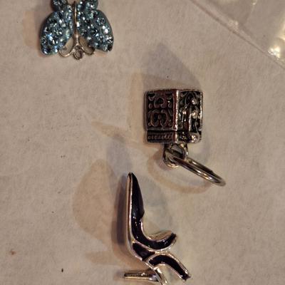 3 small charms, the butterfly is marked 925