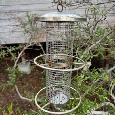 TWO BIRD FEEDERS HANGING