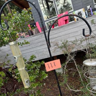 TWO BIRD FEEDERS HANGING