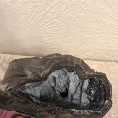 cast metal spelter clock topper of woman seated, Greek goddess maybe? Diana Artemis or Pandora? We aren't sure.