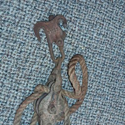 ANTIQUE DOUBLE METAL PULLEY AND A FENCE STRETCHER