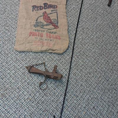 CHICKEN CATCHER, RED BIRD BURLAP BAG AND AN ANIMAL TRAP