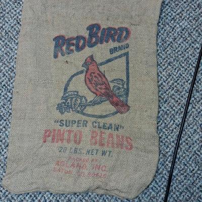 CHICKEN CATCHER, RED BIRD BURLAP BAG AND AN ANIMAL TRAP
