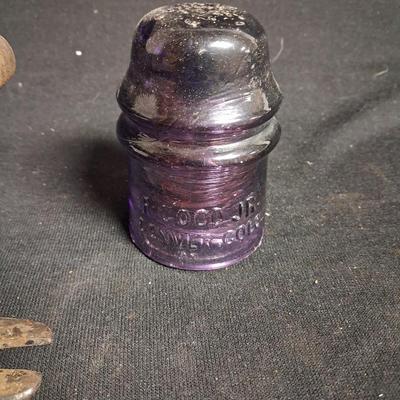 PURPLE GLASS INSULATOR AND AN IRON PERCH
