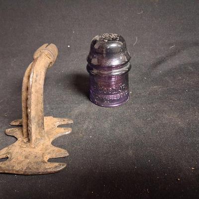 PURPLE GLASS INSULATOR AND AN IRON PERCH