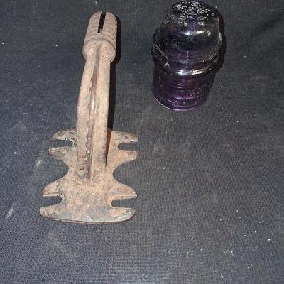 PURPLE GLASS INSULATOR AND AN IRON PERCH