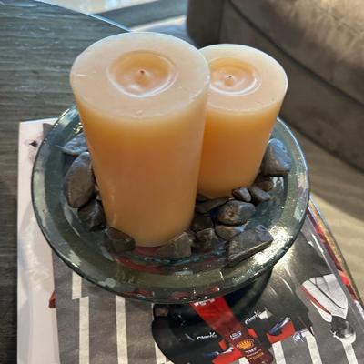 Glass tray with two candles and black rocks