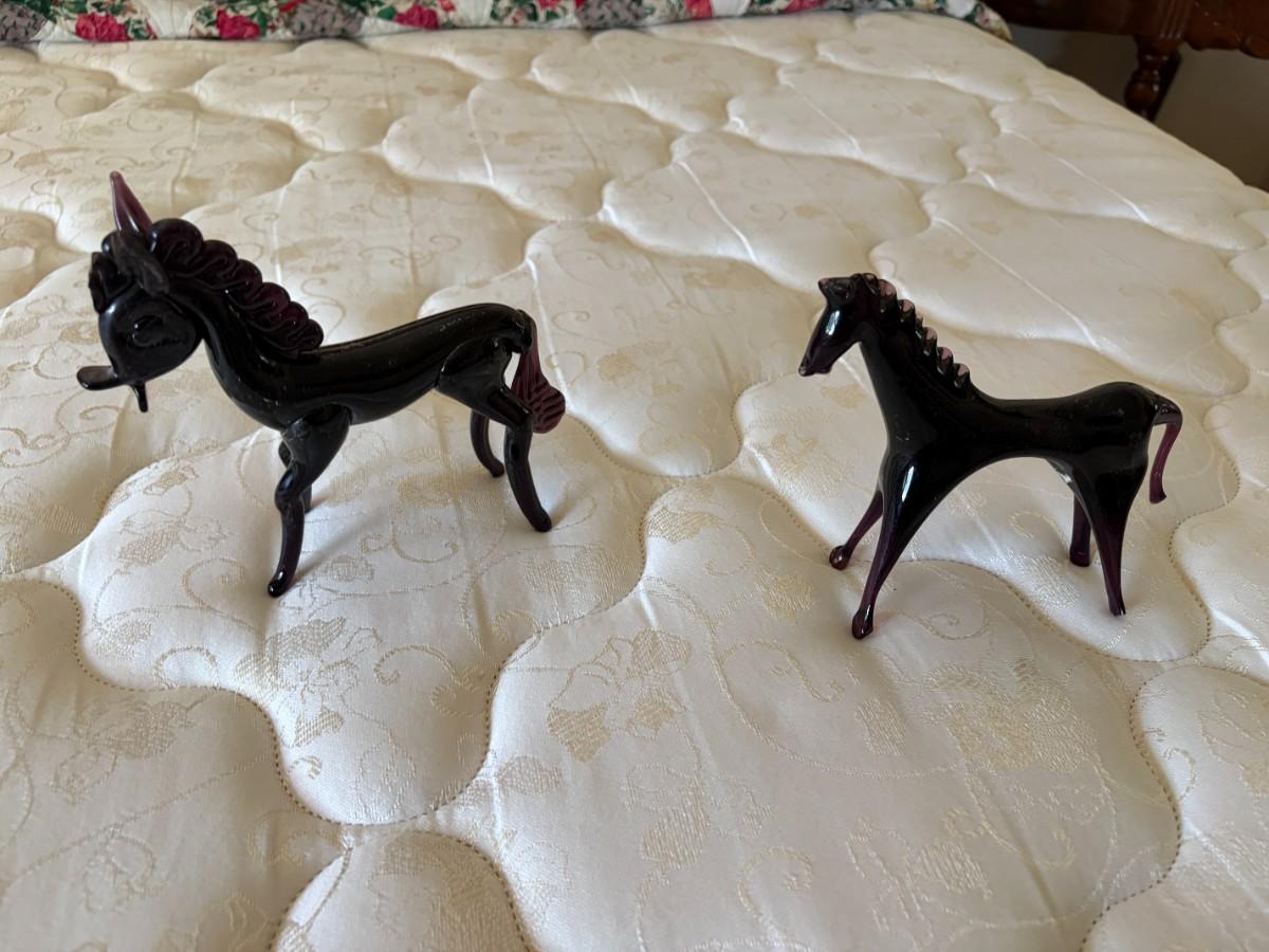2 purple glass horses