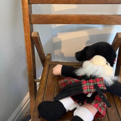 Small Folding Chair for child with Dolls on it. 