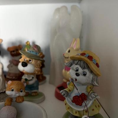 Shelf Full of Figurines in the Closet