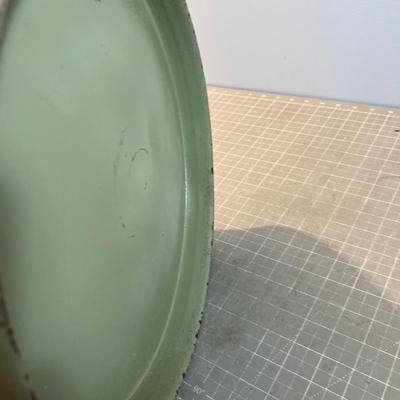 Old Milk Can that has been Painted and has Car Stickers on it. 