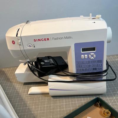 SINGER Sewing Machine Plus a Box of Bobbins 