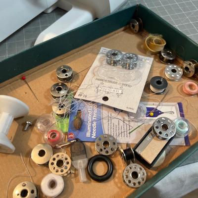 SINGER Sewing Machine Plus a Box of Bobbins 