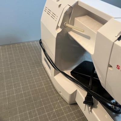 SINGER Sewing Machine Plus a Box of Bobbins 