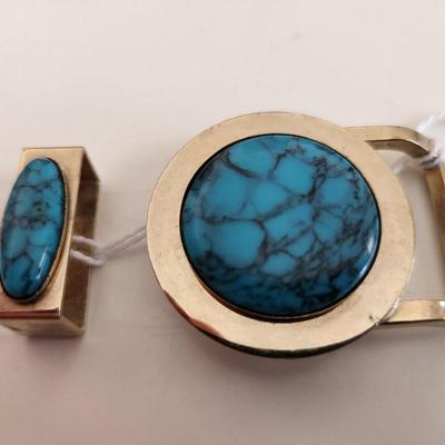 Sale Photo Thumbnail #291: This lot is for a Turquoise Belt Buckle.  Make your own belt with this snazzy buckle and matching loop. The stone is slightly larger than a US quarter. The metal is a chromy brass color.  The buckle does NOT have any rusting or damage as it appears in the