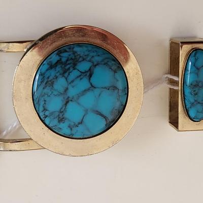 Sale Photo Thumbnail #292: This lot is for a Turquoise Belt Buckle.  Make your own belt with this snazzy buckle and matching loop. The stone is slightly larger than a US quarter. The metal is a chromy brass color.  The buckle does NOT have any rusting or damage as it appears in the