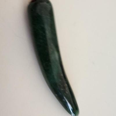 Sale Photo Thumbnail #323: This lot is for two items of Vintage Jade Jewelry.  The first item is a stick pin made with jade leaves and pink stone roses on a metal goldtoned holder. The other item is a horn-shaped jade pendant.  Either would look great worn as a fashion statement.