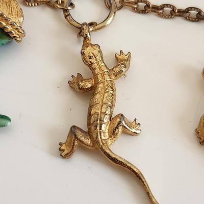 Sale Photo Thumbnail #327: This lot is for an unusual Jewelry Whatsit.  This grouping of interesting items include a Jade (?) Stone Crab Claw, a Turtle and a Salamander all chained and hooked together. Nice dangley jewel for any fashionista. Or for any other purpose one might devis