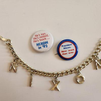 Sale Photo Thumbnail #333: This lot is for a grouping of Nixon 1992 Campaign Items.  This lot includes a nifty Nixon bracelet in a goldtoned metal and two small label pins. Very unusual.