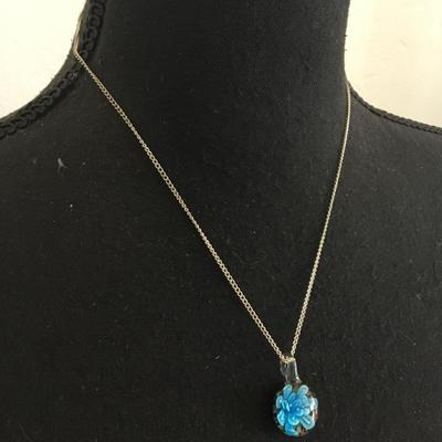 Glass pendant and silver tone chain