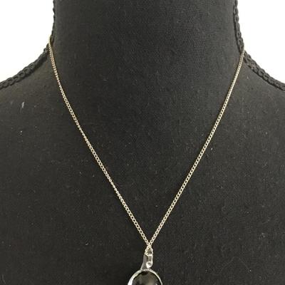 Glass pendant and silver tone chain