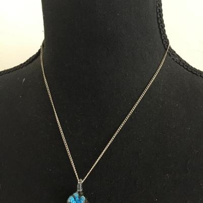 Glass pendant and silver tone chain