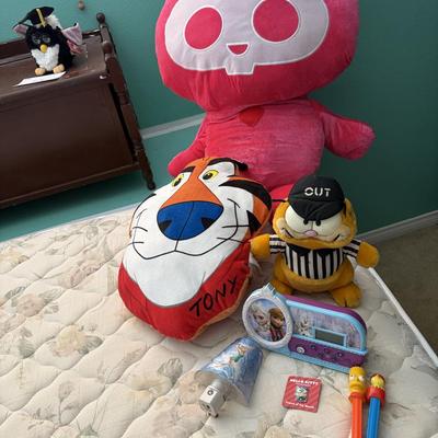 Three stuffed animals and toys