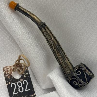 Sale Photo Thumbnail #321: Decorative silver pipe with elaborate metalwork, collectable tobacco smoking pipe.
Eastern European.  Shows wear on silver.
6.75 inches
