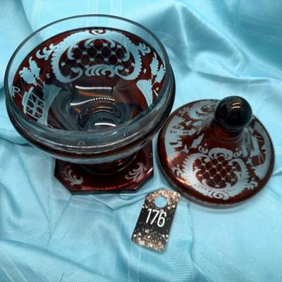 Sale Photo Thumbnail #337: Ruby red cut to clear engraved candy dish
Etchings of trees, buildings, and deer
Retails at $150, 225, 500 
9.5 inches x 6 inches