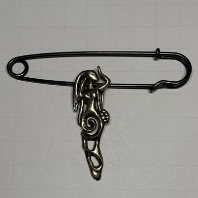 Lady pendant on vintage safety pin