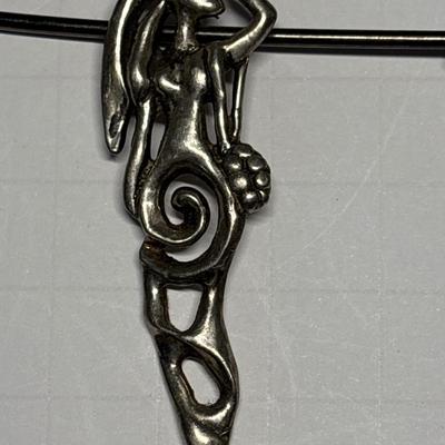 Lady pendant on vintage safety pin