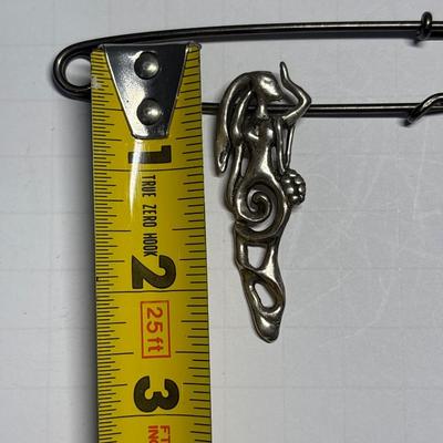 Lady pendant on vintage safety pin