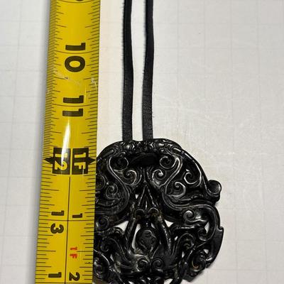 Carved Tibetan black protective stone pendant