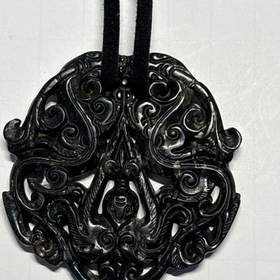 Carved Tibetan black protective stone pendant