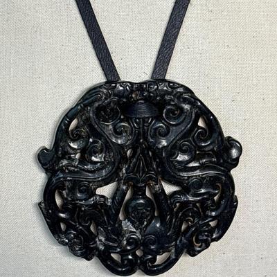 Carved Tibetan black protective stone pendant
